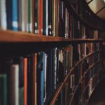 brown wooden book shelves with books