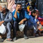 Palestinians waiting to receive food aid